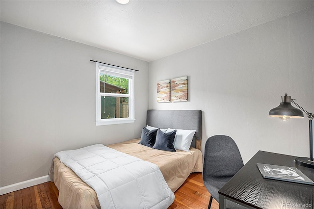 bedroom featuring hardwood / wood-style flooring