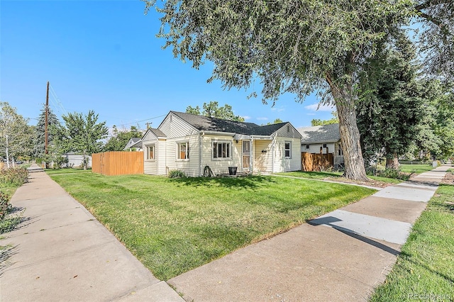 ranch-style house with a front lawn