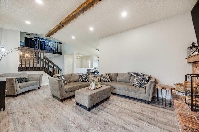 living room featuring recessed lighting, lofted ceiling with beams, stairs, and wood finished floors
