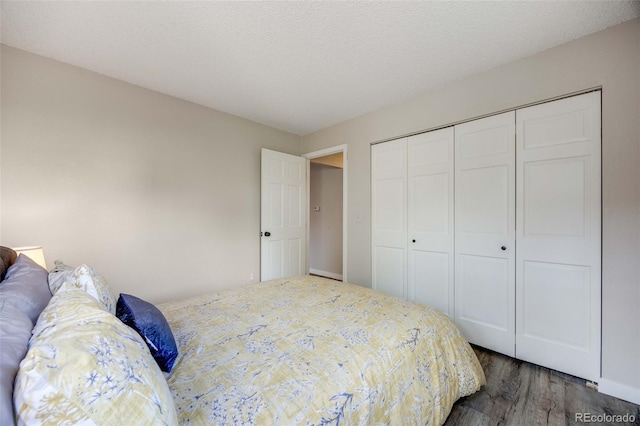 bedroom featuring a closet and wood finished floors