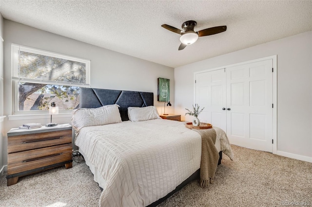 14867 E Pacific Pl, Aurora, CO 80014 - carpeted bedroom with a closet, a textured ceiling, and a ceiling fan