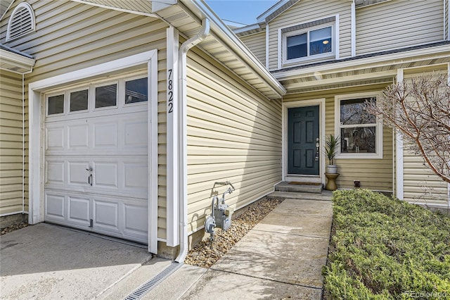 7822 S Kittredge Cir, Englewood, CO 80112 - view of exterior entry with an attached garage
