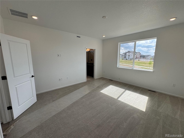 2141 S Irvington St, Aurora, CO 80018 - unfurnished bedroom featuring carpet floors, recessed lighting, and a walk in closet