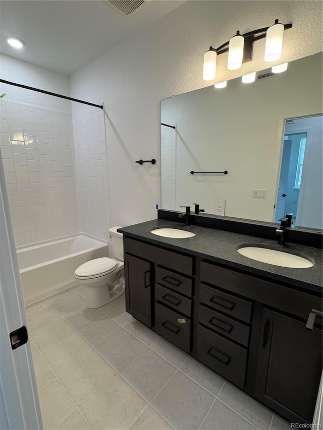2141 S Irvington St, Aurora, CO 80018 - bathroom with double vanity, tile patterned floors, and shower / bath combination