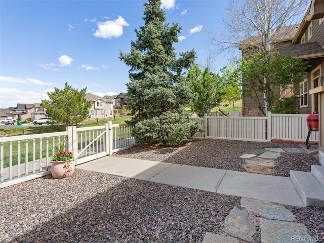 3893 Ute Mountain Trl, Castle Rock, CO 80109 - view of patio with a gate, fence, and a residential view