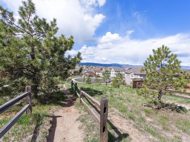 3893 Ute Mountain Trl, Castle Rock, CO 80109 - view of yard featuring fence, a residential view, and a mountain view