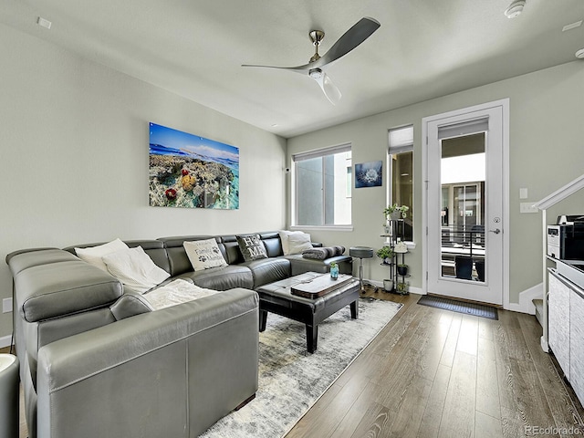 4245 E Iliff Ave Unit 2, Denver, CO 80222 - living area featuring a ceiling fan, baseboards, and dark wood finished floors