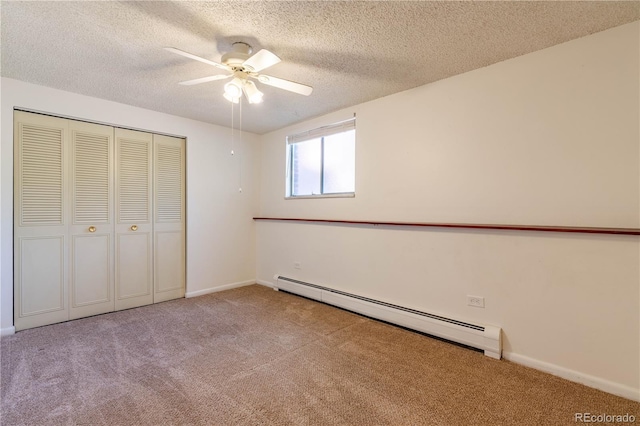 2700 S Holly St Unit 115, Denver, CO 80222 - unfurnished bedroom featuring a baseboard heating unit, carpet flooring, a textured ceiling, a closet, and ceiling fan