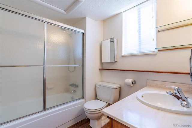 2700 S Holly St Unit 115, Denver, CO 80222 - bathroom with shower / bath combination with glass door, vanity, and wood finished floors