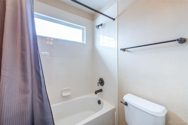 bathroom with toilet and shower / bath combo with shower curtain