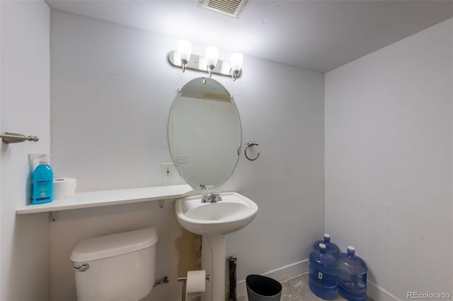 bathroom featuring toilet