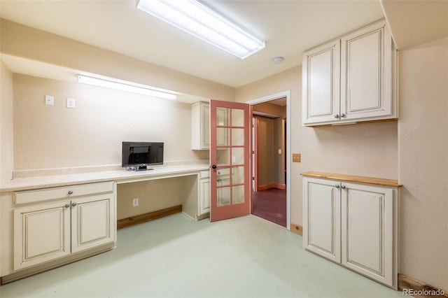 office area featuring built in desk and french doors