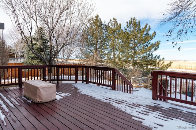 view of snow covered deck