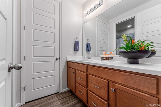 bathroom with vanity and hardwood / wood-style floors