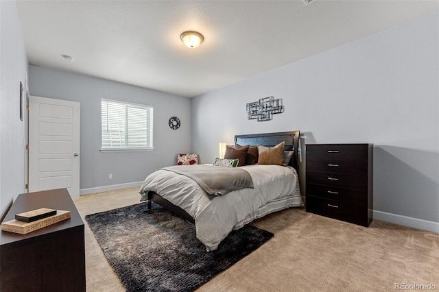 carpeted bedroom with a textured ceiling