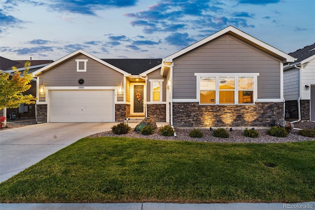 craftsman inspired home featuring a garage and a front yard