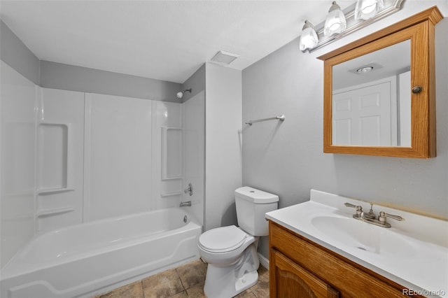 full bathroom featuring tile patterned floors, vanity, washtub / shower combination, and toilet