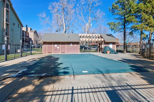 view of pool featuring a patio and an outdoor structure