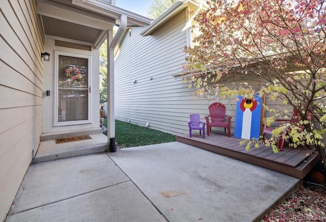 view of exterior entry featuring a patio