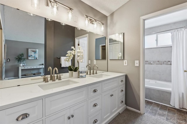 bathroom with vanity and a textured ceiling