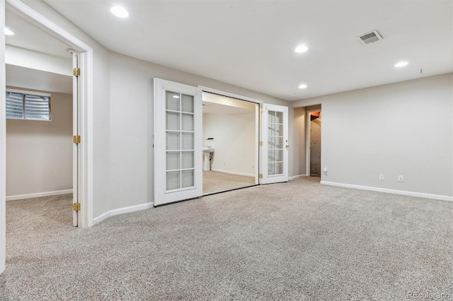 unfurnished bedroom with carpet flooring and french doors