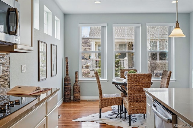 6013 Eldora St, Golden, CO 80403 - dining space featuring light wood-style flooring and recessed lighting
