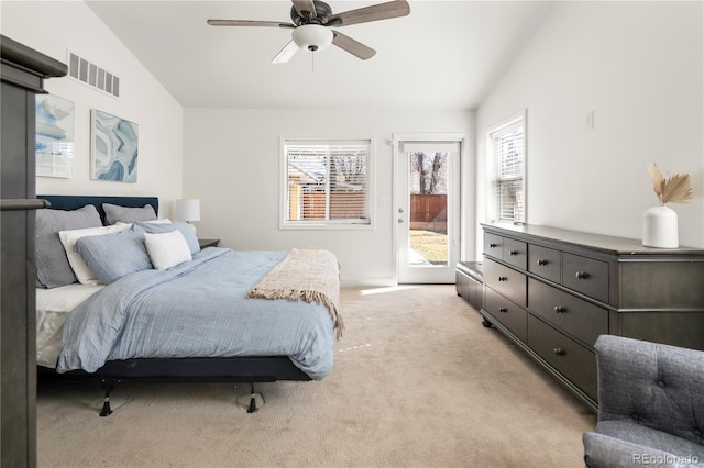 bedroom with access to exterior, visible vents, vaulted ceiling, and light colored carpet