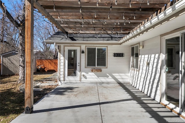 view of patio / terrace featuring fence