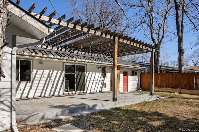 rear view of house with a patio, fence, and a pergola