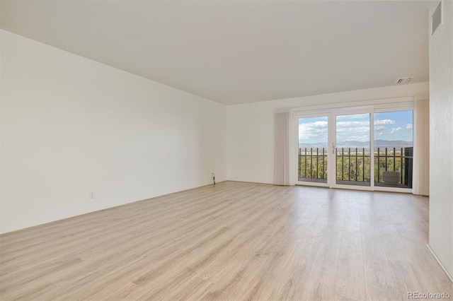460 S Marion Pkwy Unit 1103, Denver, CO 80209 - empty room with light wood finished floors