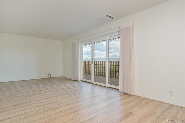 460 S Marion Pkwy Unit 1103, Denver, CO 80209 - spare room featuring light wood-style flooring