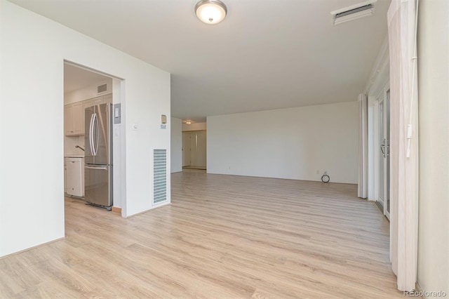 460 S Marion Pkwy Unit 1103, Denver, CO 80209 - spare room featuring light wood-style floors