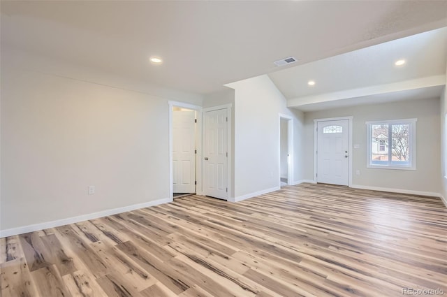 unfurnished room with light hardwood / wood-style flooring