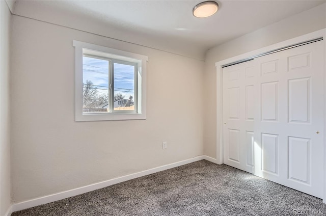 unfurnished bedroom featuring a closet and carpet