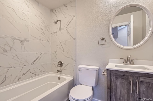 full bathroom featuring vanity, toilet, and tiled shower / bath combo