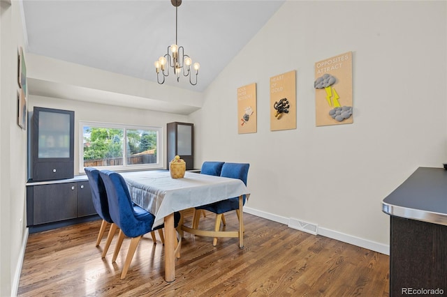 11035 E Berry Ave, Englewood, CO 80111 - dining area with a chandelier, wood finished floors, and high vaulted ceiling