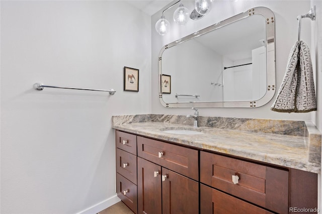 11035 E Berry Ave, Englewood, CO 80111 - bathroom with vanity and baseboards