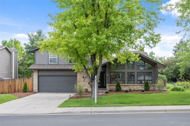 11035 E Berry Ave, Englewood, CO 80111 - view of front of home featuring concrete driveway and a garage