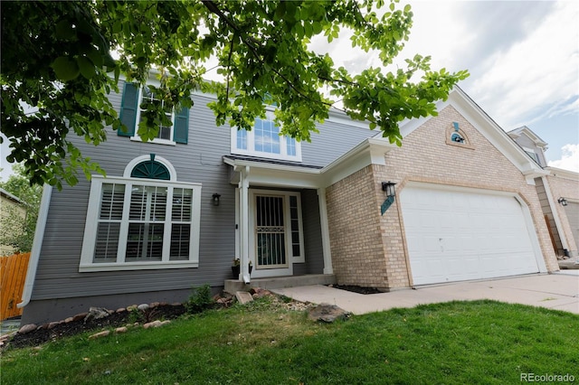 view of front facade featuring a garage and a front lawn