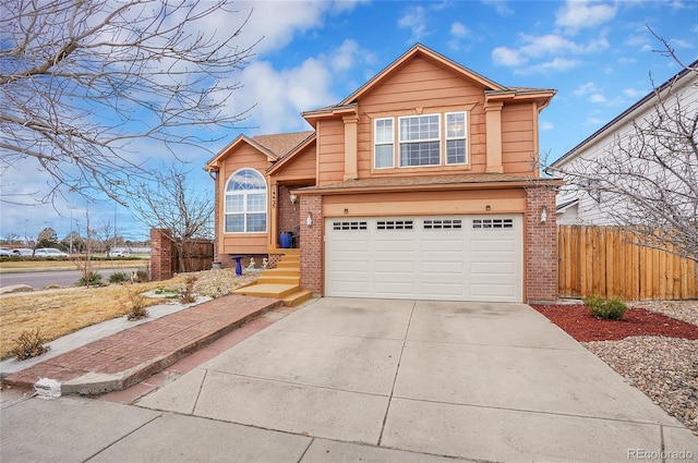 14425 E 50th Ave, Denver, CO 80239 - traditional-style home featuring brick siding, an attached garage, concrete driveway, and a shingled roof
