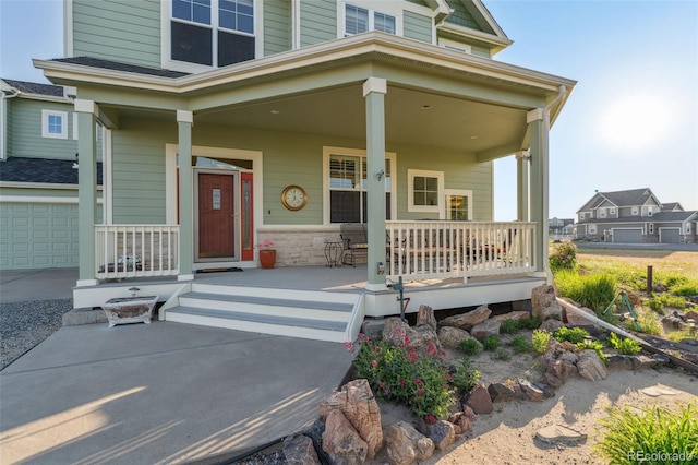 881 Kirby Ct, Watkins, CO 80137 - doorway to property with covered porch and stone siding