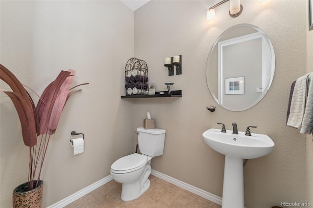 881 Kirby Ct, Watkins, CO 80137 - bathroom featuring toilet and tile patterned flooring