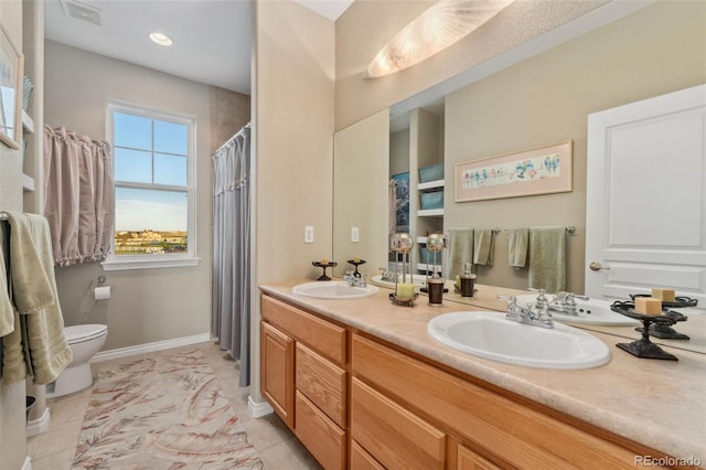 881 Kirby Ct, Watkins, CO 80137 - full bath featuring double vanity and tile patterned floors