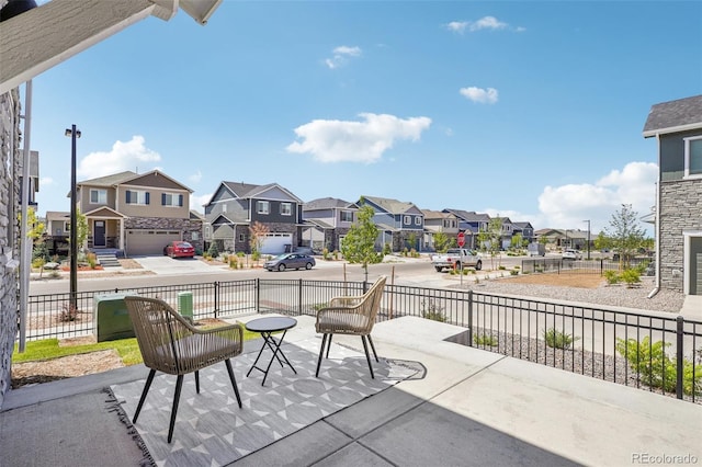 27593 E 1st Pl, Aurora, CO 80018 - view of patio / terrace featuring a residential view and fence