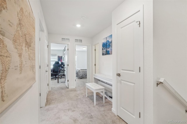 27593 E 1st Pl, Aurora, CO 80018 - hall featuring light carpet and a desk