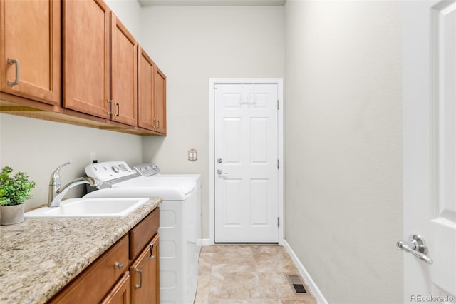 4519 Silver Mountain Loop, Broomfield, CO 80023 - clothes washing area with washer and clothes dryer, cabinet space, and baseboards