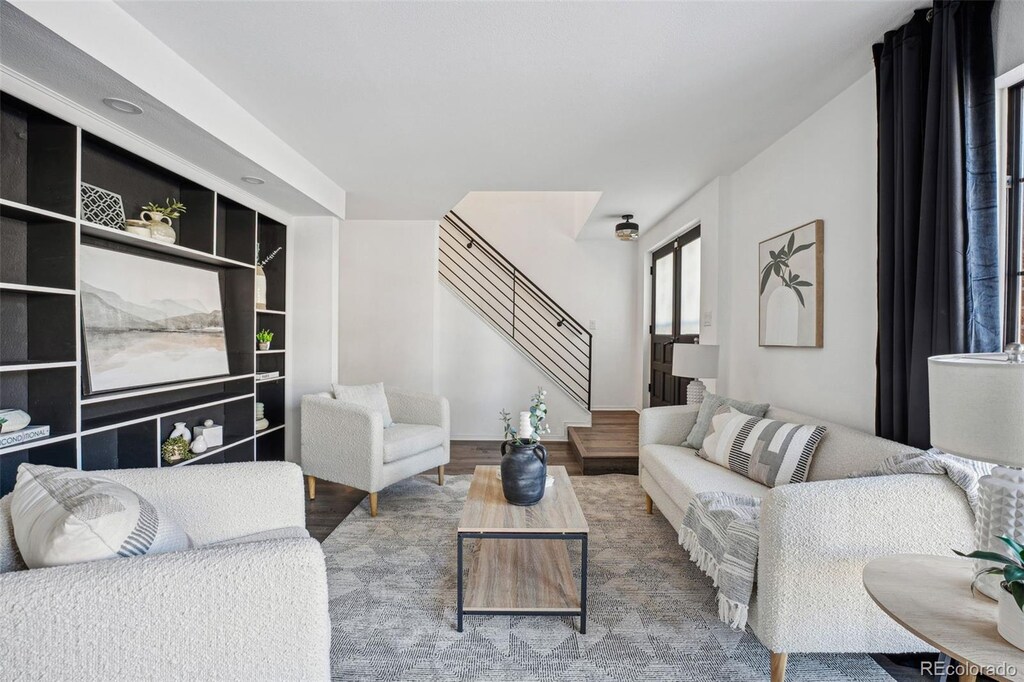 10360 E Jewell Ave Unit 95, Aurora, CO 80247 - living room with wood-type flooring and built in features