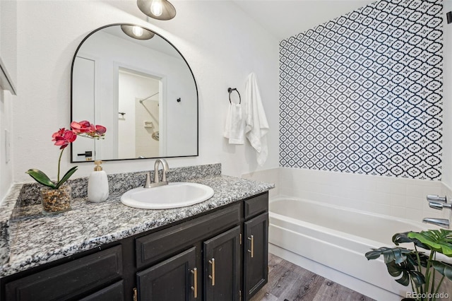 bathroom with vanity and hardwood / wood-style floors