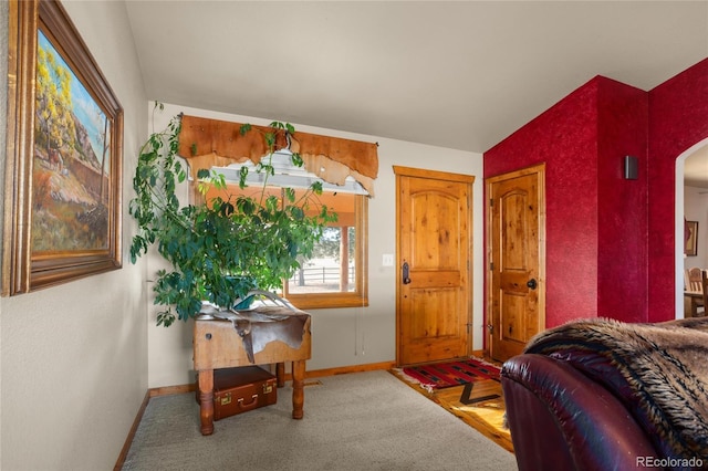 foyer entrance featuring vaulted ceiling