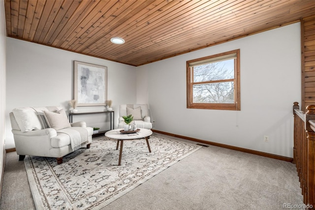 sitting room featuring visible vents, baseboards, carpet, and wooden ceiling